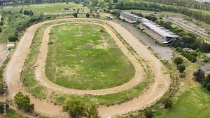 Aerial view of the hippodrome of Tor di Valle in Rome, Italy. This stadium was an important horse racing venue and included a racetrack, a training track and right track. Now it's closed and abandoned