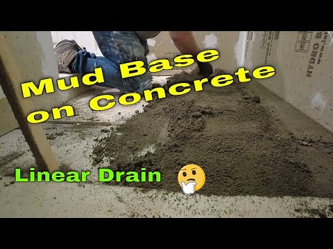 How to prep and install a mud base for a linear drain over an uneven concrete floor.
