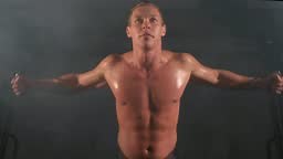 Man bodybuilder training chest muscles exercise using cable crossover...