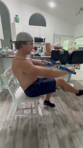 Seated band chest press with leg extension