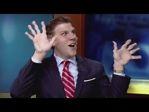 News anchor hams it up behind the desk