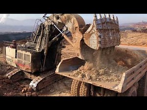 Terex RH170 Front Shovel Excavator Loading Hitachi EH3500 And Terex TR100 Dumpers