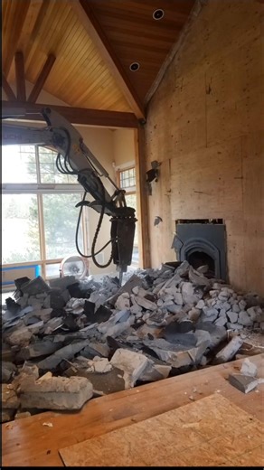 Fireplace demo excavator inside house #shorts #fyp #fun #usa #cool #house #work #tools #rock #fire