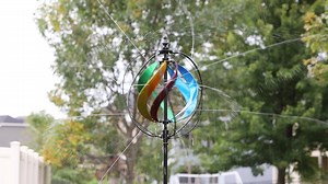Sprinkler Garden Art = A Mesmerizing Outdoor Feature. Find this Hydro Wind Spinner & Sprinker at plowandhearth.com | Country Gardens Magazine