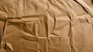 A wrinkled, brown paper surface, suitable for wrapping or crafting purposes.