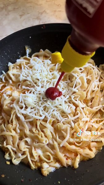 🍜 Spicy Cheesy Ramen (super low calorie/keto) I’m back with another recipe for fat loss! These noodles are super low calorie and zero net carbs..but they have an awesome texture. I can throw this dish together in just a few minutes and it’s so satisfying! Sauté a couple cloves of garlic in 1 to 2 Tbsp butter for just a minute or two. Add 1/2 cup water, some season salt (I prefer Redmond because it does remind me of a soothing flavorful ramen broth), and 1/2-1 Tbsp crunchy garlic chili oil. Toss