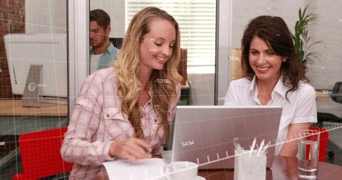 clip-3998745937-two-women-typing-desk-starting-green-graph