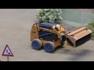Case 90Xt skid steer cleans the street