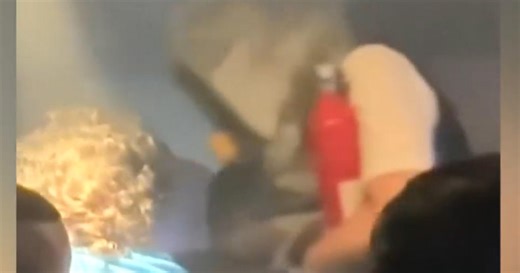Video shows smoke from a burning battery pack filling airplane cabin midflight