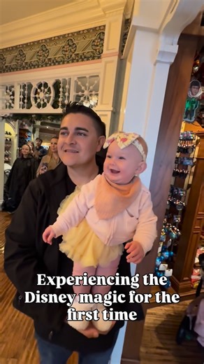 Matt & Monica | Travel Family on Instagram: "Our first Disneyland trip as a family was full of memories. This was one of the special moments, listening to the Dapper Dans on main street while shopping for souvenirs. Lilliana loved it and was all smiles. We didn’t let the rainy day ruin the magic of Disney. #disneyland #firsttimers #familyadventures"