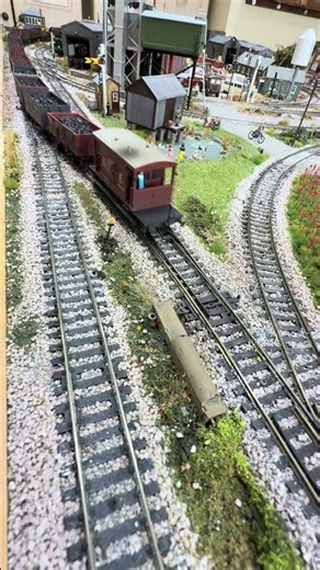 Peco streamlined points crossover passed over by LMS black "City of Edinburgh" pulling coal.