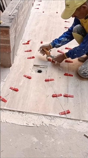 The professional way to install porcelain tiles around a drain in easy steps