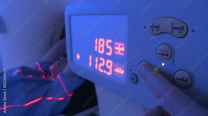 PET CT Scanner - button is pressed and anonymous patient is moved into scanner. (Filmed in ProRes with high dynamic range for flexibility for image grading)