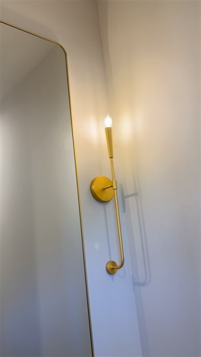 ✨ Bathroom Reno Inspo! Mixing Metals & Textures 🤩 This powder room update is giving me all the feels! We paired a gorgeous natural wood vanity with a stunning gray marbled countertop (it’s got so much movement!). The brass hardware on the vanity and the beautiful gold plumbing fixtures tie everything together for a luxurious, modern look. Plus, that sleek gold wall sconce and mirror combo? #bathroomdesign #bathroommakeover #powderroom #blisshomesdesign | Bliss Homes Design
