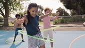 Children, school and hula hoop with friends playing outdoor together...