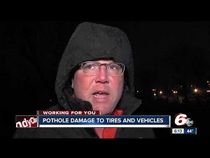 What should you do if you blow out a tire because of a pothole?