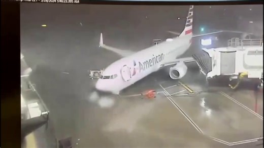 Video shows strong winds pushing American Airlines plane away from gate at DFW Airport