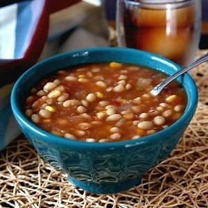 This delicious Navy Bean Soup slow cooker style is comfort food to the max. It's easy to make for dinner and is filled with a great combination of ingredients. This best bean soup recipe is made from scratch and is bursting with flavors that the whole family will love https://veganinthefreezer.com/slow-cooker-navy-bean-soup/ | Vegan in the Freezer