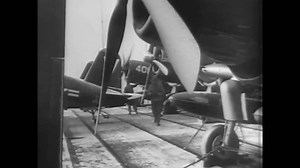 CIRCA 1950s - A rail-track track laying machine is used and farmland is seen from a traveling train.