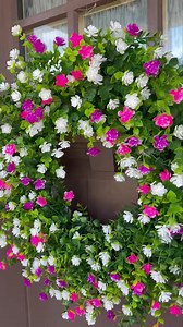 If you’re still struggling from “springing forward” yesterday, then this pretty Spring floral wreath is sure to brighten your day! Featuring bright pink, fuchsia, and white UV resistant flowers, this wreath can be gently wiped clean and won’t fade in the sun. Best of all, no hot glue was used to make it so it will last for years to come! Get yours today - link in comments! #spring #springiscoming #springdecor #springhassprung #wreaths #handmade #floralwreath #giftideas | Carrie's Wreath Creation