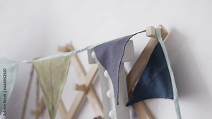 Decorative triangular small flags made by female tailor indoors Stock Video