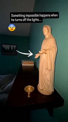 Apocalyptic Time on Instagram: "Did She actually move? This clip shows a man testing his room lights when something impossible happens. With the light ON, the old Virgin Mary statue his grandmother gifted him looks normal. But after turning the light OFF and ON again, the statue’s hand is suddenly in a different position. No cuts. No one else there. So… why would a sacred statue move only in the dark? What do you think happened? What would you do?"