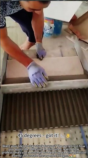 Using a notched trowel for perfect tile adhesive! 🔨🎯