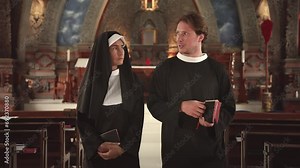 Nun and Clergyman Walking Inside Church before Prayer. Man and Woman Talking in Church about Religion Faith. Young Adult Pope and Sister Talk about God Together Indoors Chapel. Talk about Bible 4k