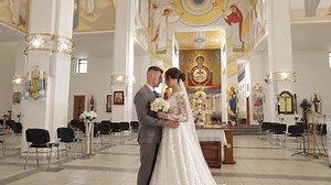 Lovely family newlyweds couple bride embracing groom in an old church, wedding ceremony, matrimony