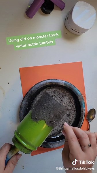 Making a Grave Digger Monster Truck tumbler and using real dirt for the dirt mound! thank you @mary_dearmin for the idea!! #glitter #tumbler #waterbottle #glittertumbler #create #custom #tumblermaker #thingamajigsdohickeys #followonfacebook #followoninsta #followontiktok #smallbusinesscheck #glitterless #dirt #monstertruck