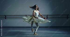 Super slow motion of graceful modern contemporary female dancer practices with focus and elegance in dance school or gym, refining her technique and expression through rigorous training and dedication Stock Video
