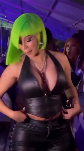 Fashion Bomb Daily on Instagram: "@fashionbombhair flash! @iamcardib debuted new neon hair styled by @tokyostylez at #ArtBasel wearing a black leather halter top, lace-up leather pants, and a glossy croc-embossed handbag. Hot! Or Hmm..? 📸: @wdlmwandooley . 📹: @everydayppl // @jooeljames #CardiB #CardiBFBD #Cardi style #fashionbombdaily #fbdaily #BombStyle"