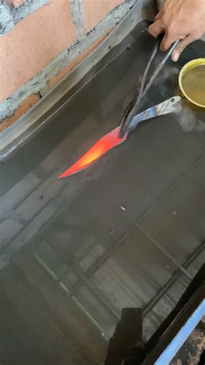 Watch the blade harden in water by the smith #blacksmith #knife #fyp #viral