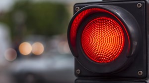 Yes, you need to pull all the way up to the white line at an intersection in order for stoplights to change