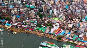 Dhaka city slums running along the Buriganga river, Bangladesh. Aerial