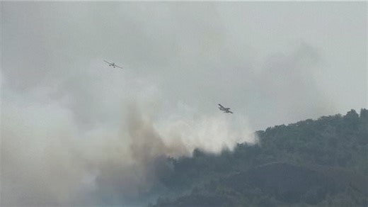 Planes waterbomb Greece's out-of-control wildfire in Rhodes
