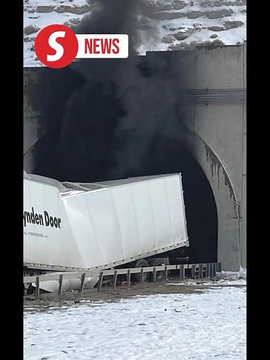 Investigators enter a highway tunnel in Wyoming where a fiery crash killed two