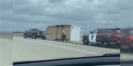 Truck trailer rolls onto side on I-90 near Dexter