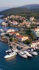 A place I call home📍 Fiskardo – Kefalonia Island ❤️ By Greg Peter Patrikios GoingGreece Follow us on Instagram www.instagram.com/goinggreece There’s something about this little harbor that just gets to you. The boats resting in the bay, the houses painted in colors that shine in the light, and behind it all the green fertile mountains rising quietly above the water. It feels calm, almost too perfect, like a place you’d want to keep for yourself but can’t help sharing.❤️ Would you spend some tim