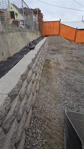 Check out this gravel installation video! We cleared out the existing slope at the customer's property and built a 120-foot retaining wall. Then we installed a long-lasting landscape tarp with gravel over it for a clean, low-maintenance finish. Message us for more details! Licensed, insured, and bonded landscape contractors. | Northwest Lawn Legends
