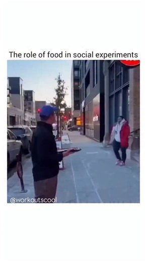 Workouts Crew on Instagram: "A man in a black jacket and blue cap stands on a city sidewalk, holding a plate of sushi rolls. He approaches a man in a red jacket and white hoodie, offering him a sushi roll. After the man accepts it, the first man says, “Double it and give it to the next person,” and proceeds to hand over another roll. He then looks around, searching for the next person, while holding the plate. The scene ends with the man in the black jacket now holding two plates—one in each han