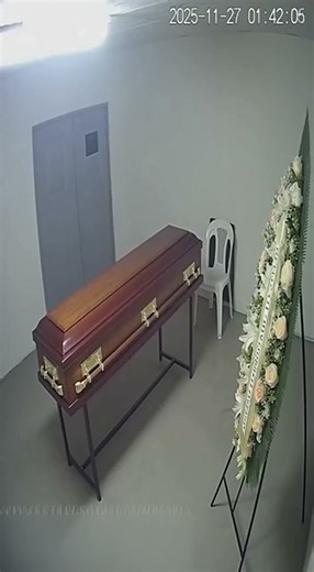 CCTV in this morgue viewing room caught the coffin lid lift then the flowers slide and the chair