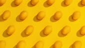 Stop motion lemons with shadows on a yellow background. A modern look...