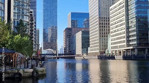 London, Canary Wharf area view form the South Dock at sunny day. London, UK 2025