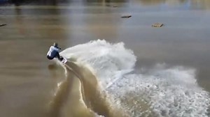 Drone footage captures man wakeboarding through floodwaters in UK