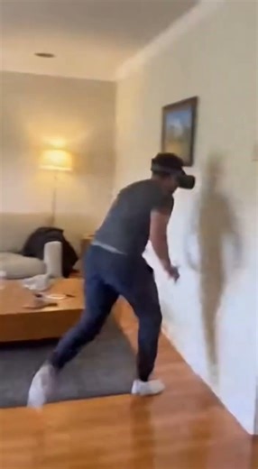 Man in #VR gets scared and hilariously crashes into a wall 😄