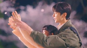 throughout the entire Lovely Runner episode, this cherry blossom scene is undoubtedly one of the most beautiful. the way they kissed, closed their eyes, and gave one other a backward embrace is just such a wonderful scene. | Zoe Atthaphan