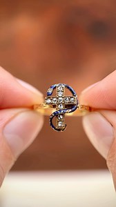 A wonderful antique enamelled snake and cross ring. This piece probably started life as a stickpin dating to the second half of the 19th century, circa 1870 - and was later converted into a ring. It is crafted in 18K yellow gold and the serpents body is emblazoned with vibrant cobalt blue guilloché enamel which provides a luminous reptilian texture. The snake coils around a rose cut diamond studded cross, with a further rose cut decorating the serpent’s head. UK size M, US size 6.25 #antiquejewe