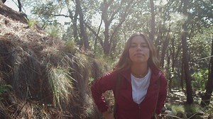 Woman hiking in the forest - Free Stock Video