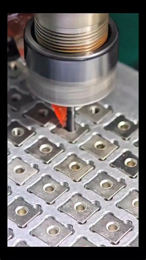 Real Engineerings | Engineering & Technology & Gadgets & DIY on Instagram: "High-Speed Tapping: The Rhythm of Threads! 🔩⚙️ ​Watch the mesmerizing precision of a CNC machine performing a rapid Tapping operation! This is the process of cutting internal threads into a pre-drilled hole, allowing screws or bolts to be fastened into these metal plates later. ​The Engineering Breakdown ​This isn't just spinning a tool; it requires perfect synchronization: ​Rigid Tapping: Notice how the tool (the tap) 
